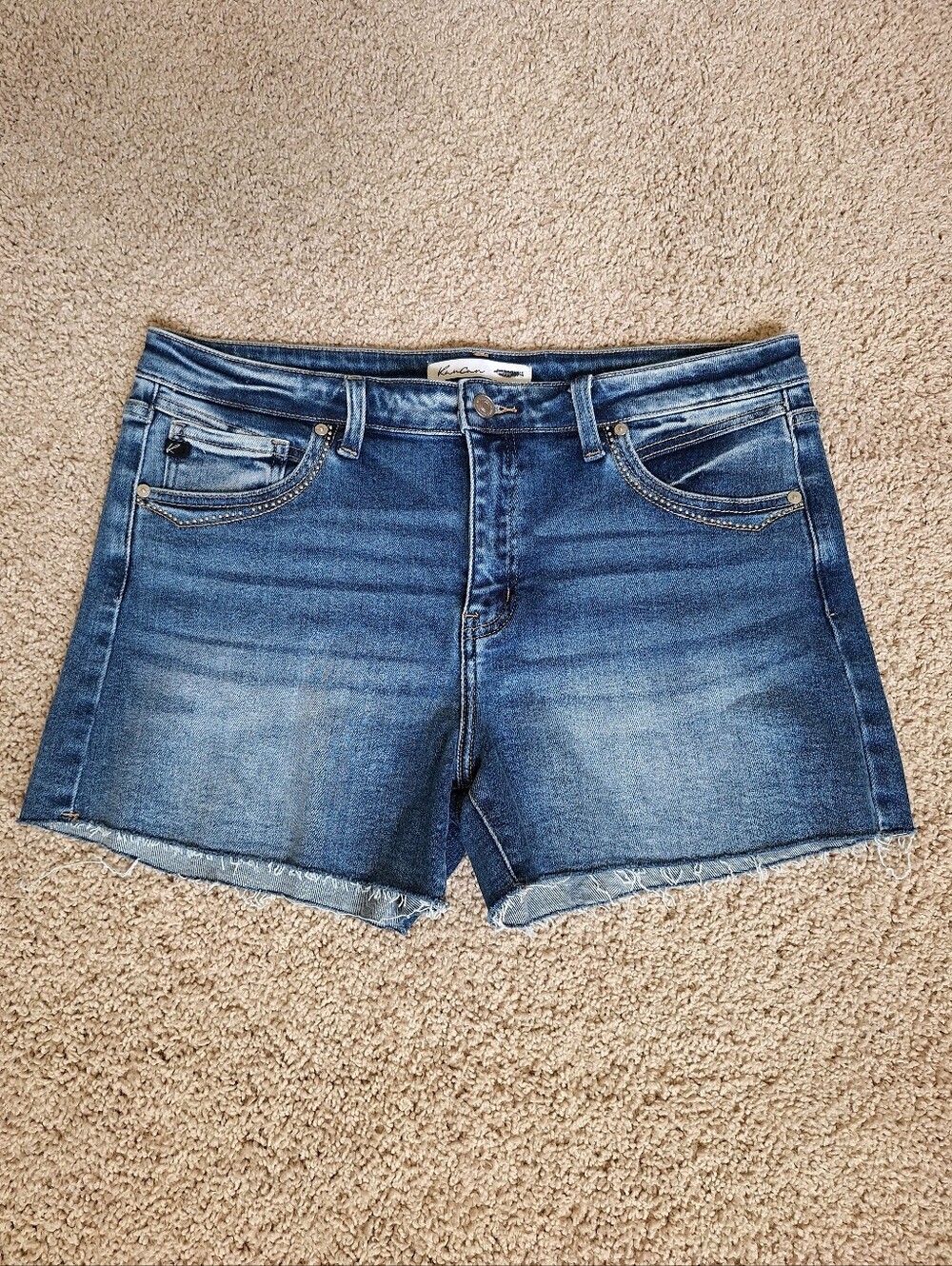 Kan Can medium wash denim shorts with a raw hem studded pocket details Size 31